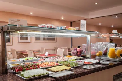 a buffet line with many different types of food at Sunotel Junior in Barcelona