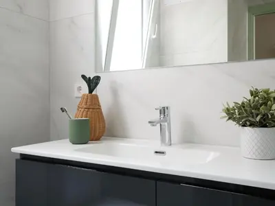 a bathroom with a sink and a mirror at Casa Cosi El Farro 4 in Barcelona