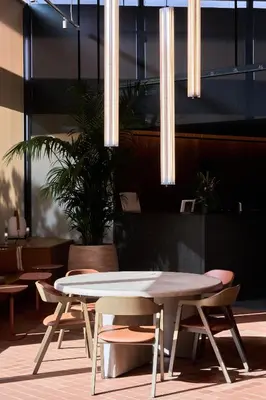 a table and chairs in a room with lights at Barcelona Princess in Barcelona