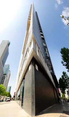 a tall building with a steeple on top of it at Barcelona Princess in Barcelona