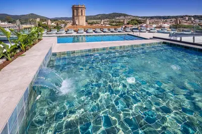 a swimming pool with a view of a city at Mercè in Pineda de Mar