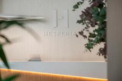 a wall with a sign for a hospital at Hesperia Barcelona Sant Just in Sant Just Desvern
