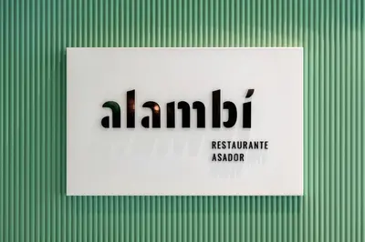 a sign with the name of a lambert on a green background at Hesperia Barcelona Sant Just in Sant Just Desvern