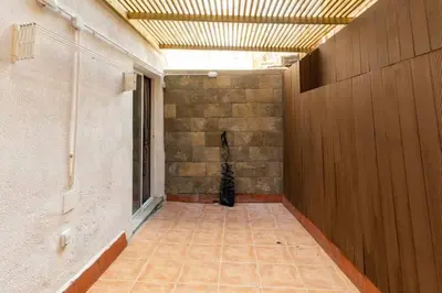 an empty hallway with a cat sitting in the corner of a building at apartamento con calefaccion y parkig privado gratis in Badalona