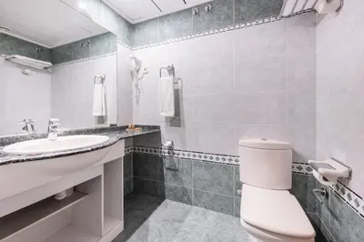 a bathroom with a toilet and a sink at Aparthotel Napols - Abapart in Barcelona