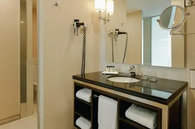 a bathroom with a sink and a mirror at Hesperia Barcelona Presidente in Barcelona