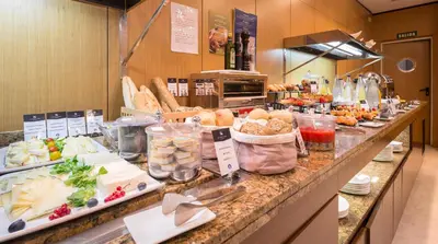 a buffet line with many different types of food at Eurostars Monumental in Barcelona