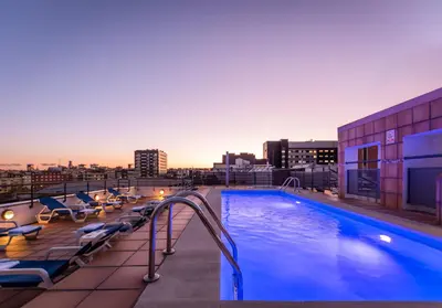a swimming pool on the roof of a building at Sunotel Aston in Barcelona