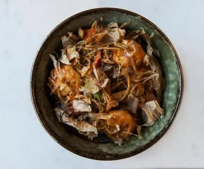 a bowl of food sitting on a table at Axel Hotel Barcelona - Adults Only in Barcelona