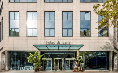 a swimming pool with a fountain on a building at Hotel SB Icaria in Barcelona