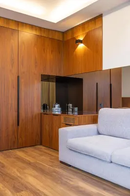 a bedroom with a large white bed and a couch at Hotel SB Icaria in Barcelona