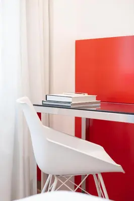 a hotel room with a bed and a couch at Hotel SB Icaria in Barcelona