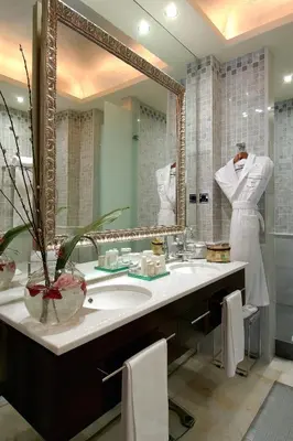 a bathroom with a sink and a large mirror at Hotel Casa Fuster G.L Monumento in Barcelona