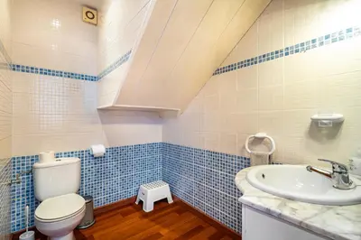 a bathroom with a toilet and a sink at Dream House in Badalona