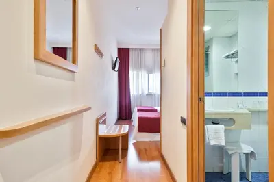 a bathroom with a sink and a mirror at Acta Antibes in Barcelona
