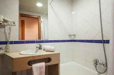 a bathroom with a sink and a shower at Acta Antibes in Barcelona