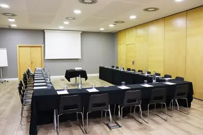 a large conference room with a long table and chairs at Eurohotel Barcelona Granvia Fira in Hospitalet de Llobregat