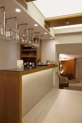 a kitchen with a bar in a room at Best Western Premier Hotel Dante in Barcelona