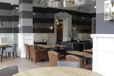 a dining room with tables and chairs in a restaurant at Hotel Granvia in Barcelona