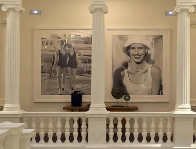 a picture of a woman in a hat on a wall at Hotel Granvia in Barcelona