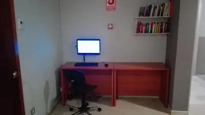 a desk with a computer monitor on top of it at Hotel Inglés in Barcelona