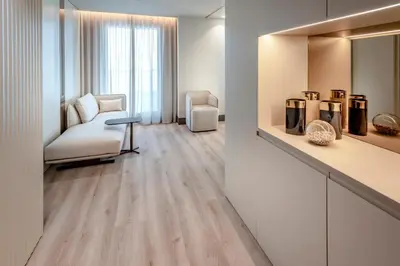 a living room with a couch and a chair at Bel Air in Castelldefels