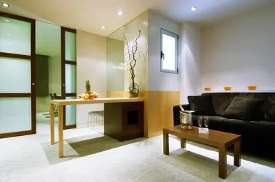 a living room with a couch and a table at Hotel Urpí in Sabadell