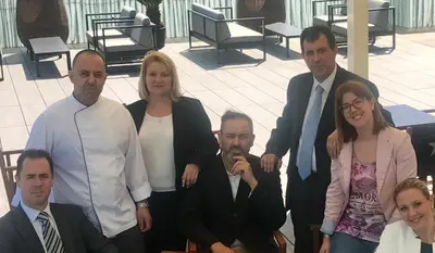 a group of people are posing for a picture at Hotel Urpí in Sabadell