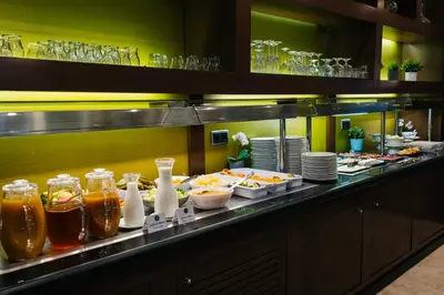 a buffet line with many plates of food at Abba Rambla Hotel in Barcelona