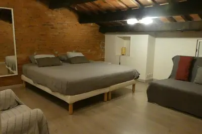 a kitchen and dining room with a table and a stairway at Charming house next to the sea and Barcelona for 6 in Badalona