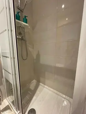a bathroom with a shower with a glass door at Pensión Bertolín in Barcelona