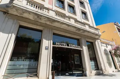 a store front of a building with glass windows at Espanya - 30º hotels in Calella