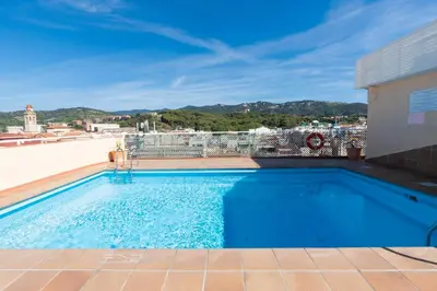 a swimming pool on top of a building at Espanya - 30º hotels in Calella