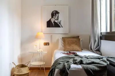 a bedroom with a bed with a blanket on it at Canela Homes COSTA CA NOSTRA in Gavà