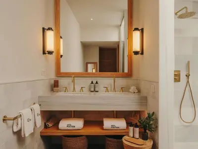 a bathroom with a sink and a mirror at Hotel Pulitzer Barcelona in Barcelona