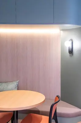 a room with a table and chairs and a blue ceiling at Aparthotel Atenea Calabria in Barcelona