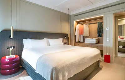 a bedroom with a large bed and a closet at El Avenida Palace in Barcelona