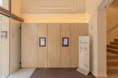 a hallway with wooden walls and stairs in a building at Líbere Barcelona Sant Antoni in Barcelona