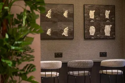a restaurant with tables and chairs and a kitchen at Hesperia Barcelona Barri Gòtic in Barcelona
