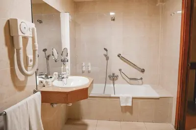a bathroom with a sink and a bath tub at htop Pineda Palace 4Sup - Adults Only #htopBliss in Pineda de Mar