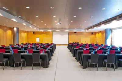 a large room with tables and chairs in it at Alexandre Fira Congress in Hospitalet de Llobregat
