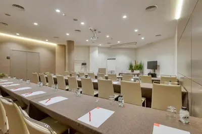 a conference room with a long table and chairs at Hotel America Barcelona in Barcelona