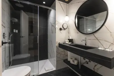 a bathroom with a sink and a mirror at Hotel Barcelona Catedral 4 Sup in Barcelona