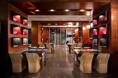 a restaurant with tables and chairs in a room at Olivia Plaza Hotel in Barcelona