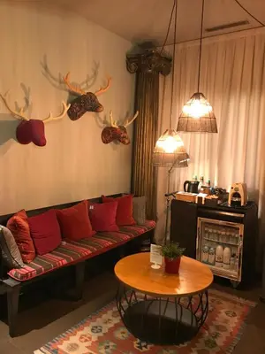 a living room with a couch and a table at Chic & Basic Zoo in Barcelona