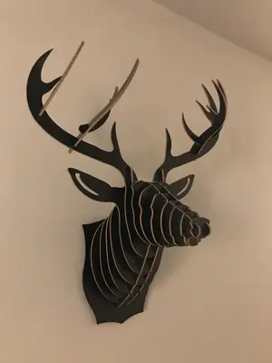a wall mounted stag head with antlers on a wall at Chic & Basic Zoo in Barcelona