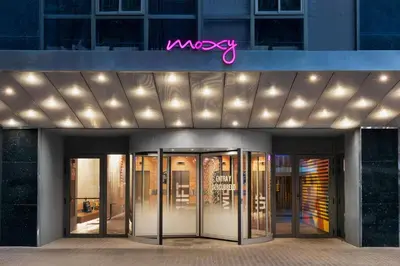 a view of a building with a sign on it at Moxy Barcelona in Barcelona