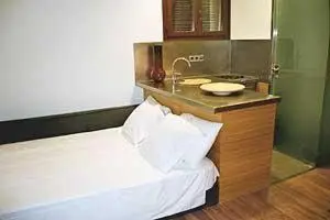 a bathroom with a sink and a bed in a room at BCN2STAY Apartments in Barcelona