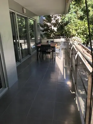 a patio with a table and chairs on a balcony at Standing Apartment Barcelona Forum in Sant Adria de Besos