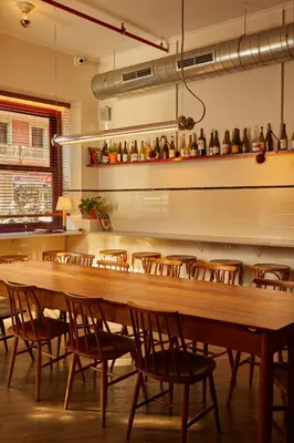 a dining room with a large wooden table and chairs at Hotel Regina Barcelona in Barcelona